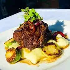 Tommy V's Urban Kitchen & Bar signature dishes Short RibsPasta TrioButternut Squash Ravioli